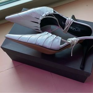 Closed pointy toe heels with wrap around laces